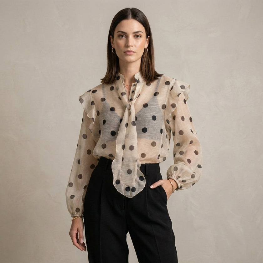 FJØRNA women's summer polka dot blouse with long sleeves, stylish and lightweight top worn by a model.