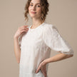 FJØRNA women's floral V-neck summer top worn by a model, lightweight and stylish women's clothing for warm weather.
