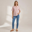 FJØRNA women's striped summer blouse with short sleeves, worn by a model showcasing casual, stylish top for warm weather.