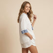 FJØRNA women's summer two-piece set with geometric pockets, featuring a stylish top and matching shorts worn by a model.