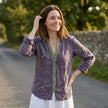 FJØRNA women's summer blouse with floral print, V-neck, long sleeves, made of lightweight linen fabric, styled on a model