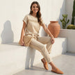 FJØRNA women's two-piece co-ord set with mesh pockets, featuring a stylish top and matching pants on a model.