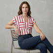 FJØRNA women's summer blouse with striped pattern and V-neck, styled on a model showcasing lightweight, casual top.