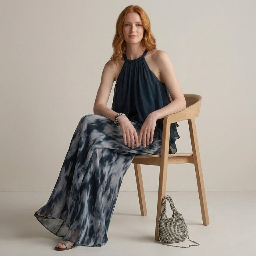 Model wearing FJØRNA Midnight Mist halter blouse and flowing pant set, showcasing elegant 2-piece outfit with a relaxed fit.