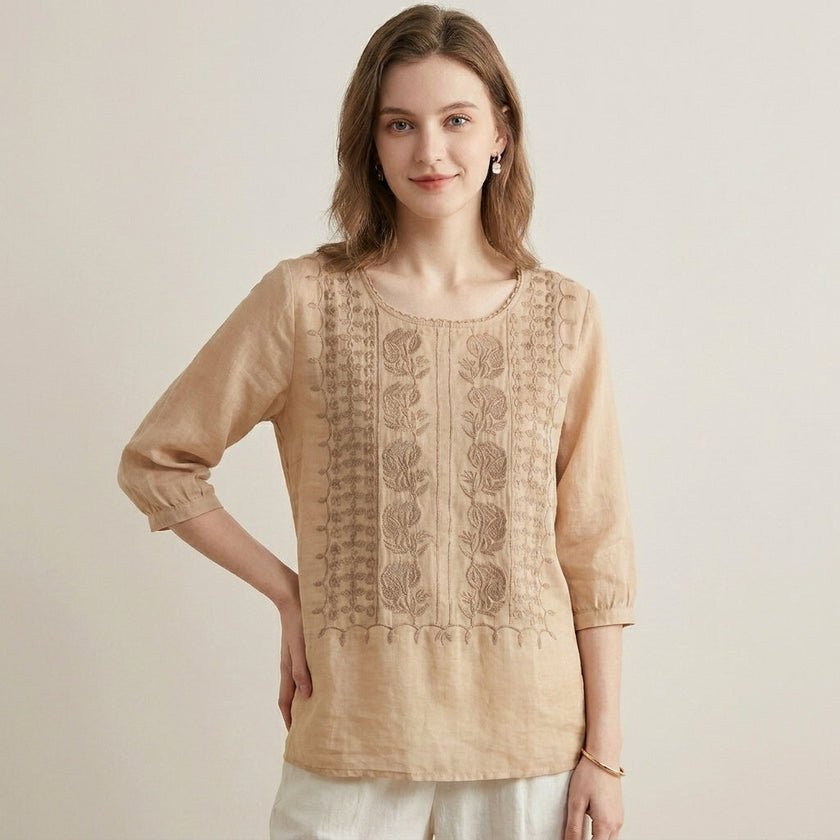 FJØRNA floral V-neck summer blouse for women, lightweight and stylish with a colorful floral pattern, worn by a model.