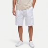 Male model wearing FJØRNA men's linen cargo shorts with drawstring waist, showcasing relaxed fit and lightweight fabric.