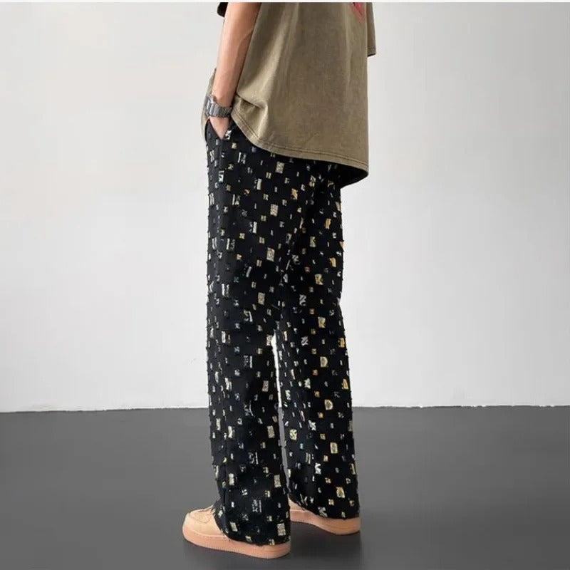 White straight-fit trousers by FJØRNA displayed on a mosaic background, showcasing a sleek, tailored design perfect for casual or formal wear.