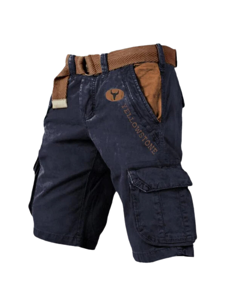 FJØRNA men's lightweight cargo shorts with multiple pockets, designed for comfort and versatility, shown in a natural outdoor setting.