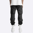FJØRNA men's multifunctional cargo pants with multiple pockets, durable fabric, and versatile design for outdoor and casual wear.
