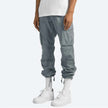 FJØRNA men's cargo pants with multiple pockets, featuring a rugged design and functional style for outdoor and casual wear.