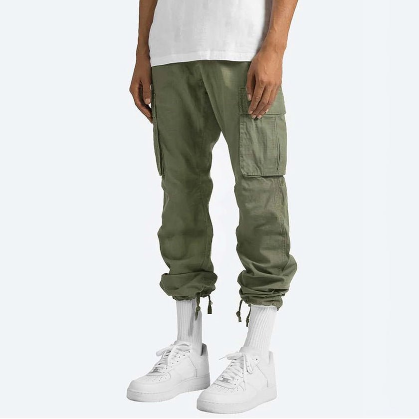 FJØRNA men's multifunctional cargo pants with multiple pockets, rugged design, and comfortable fit for outdoor activities.