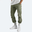 FJØRNA men's multifunctional cargo pants with multiple pockets, featuring a rugged design and durable fabric for outdoor wear.
