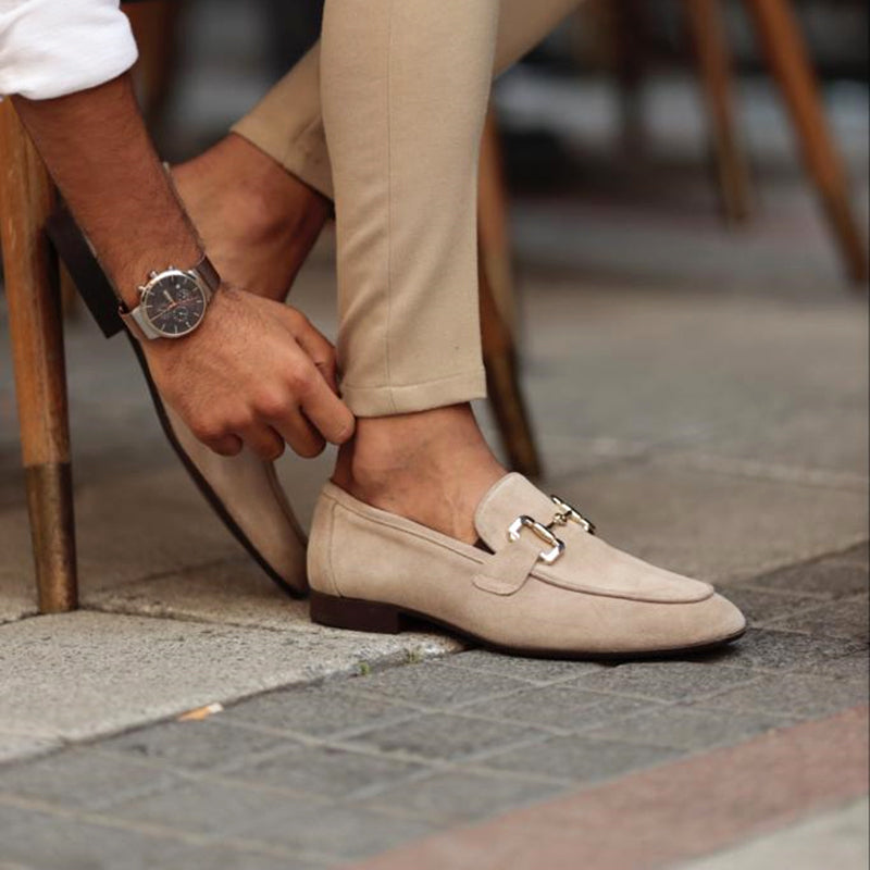 Men's beige suede FJØRNA horsebit loafers with almond toe, detailed view of classic slip-on footwear.