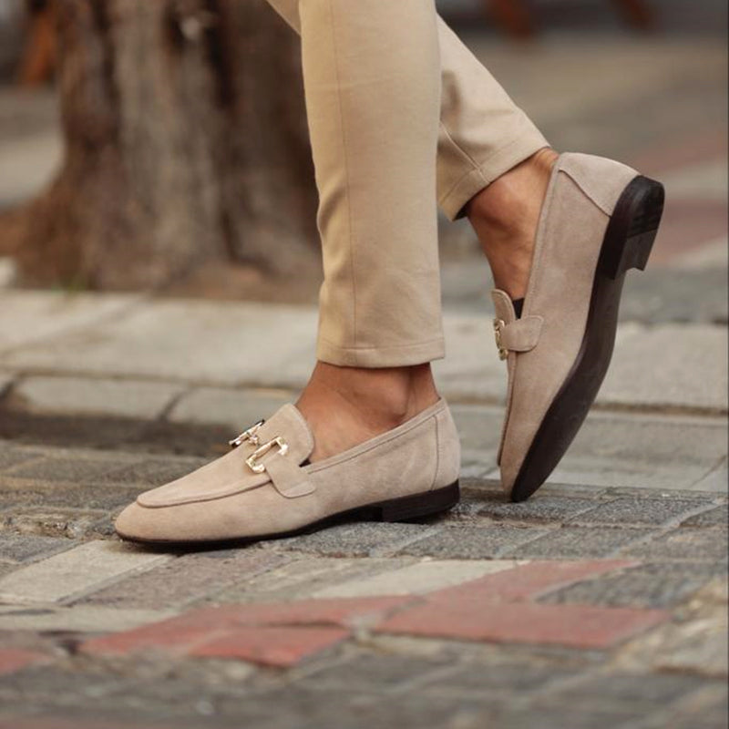 Beige men's suede loafers with horsebit detail and almond toe from FJØRNA, showcasing the stylish slip-on design.