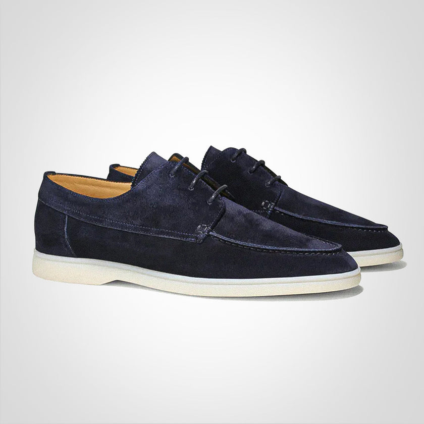 Men's modern slip-on dress shoes by FJØRNA with a sleek silhouette in dark blue, suitable for formal occasions.