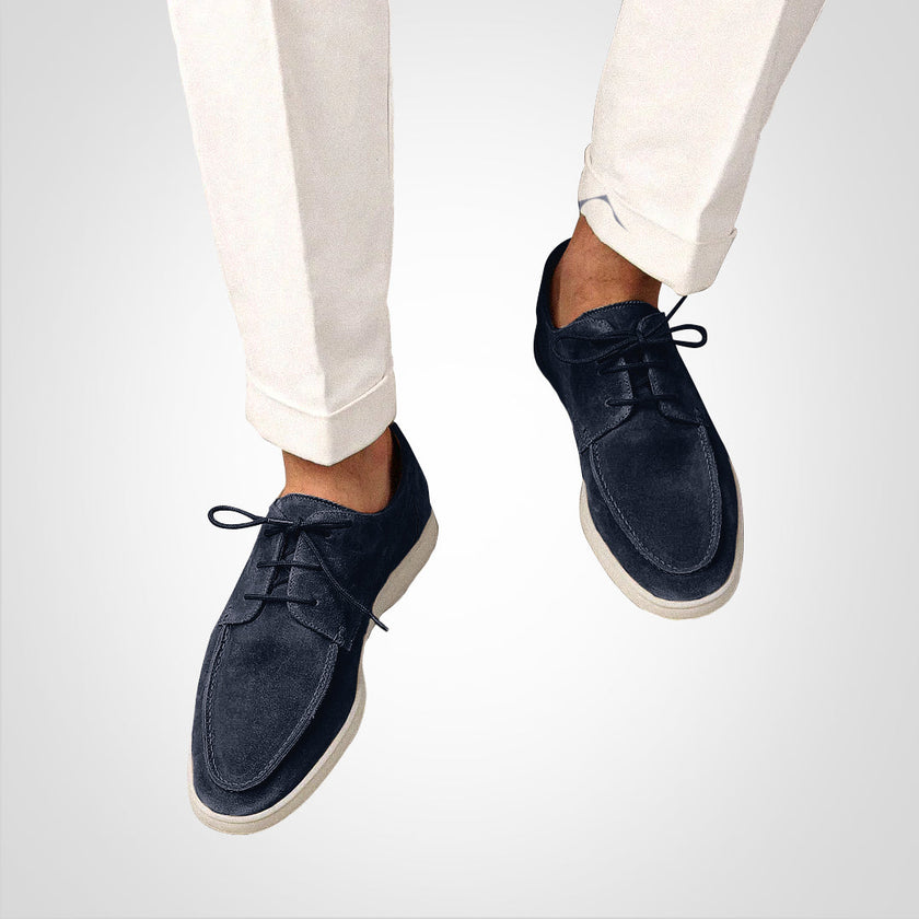 Men's modern slip-on dress shoes by FJØRNA in dark blue with a sleek silhouette, suitable for formal occasions.