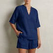 Navy blue women's summer two-piece co-ord set with V-neck top and pocket detail, stylish and comfortable for warm weather.