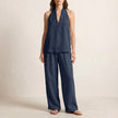 Navy blue FJØRNA relaxed two-piece halter V-neck set with wide-leg pants, displayed on a hanger.