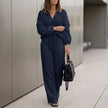 Navy blue oversized two-piece crinkle-texture suit with relaxed fit and drawstring waist, ideal for casual or stylish wear.