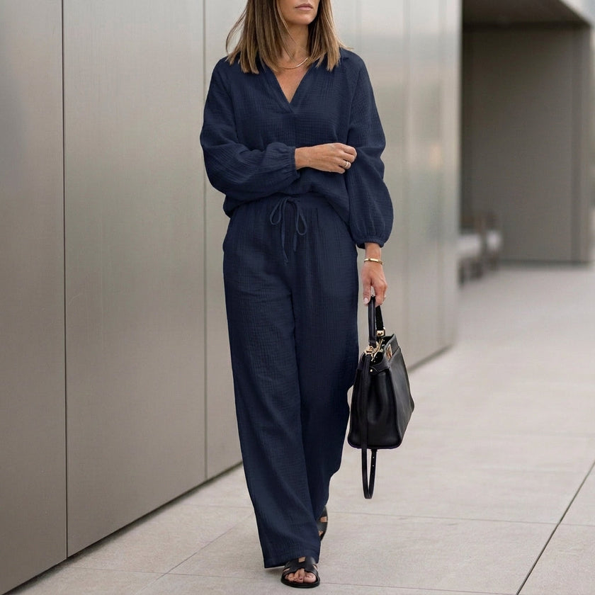 Navy blue oversized two-piece crinkle-texture suit with relaxed fit and drawstring waist, ideal for casual or stylish wear.