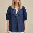 Navy blue women's summer blouse with V-neck and puff sleeves, stylish top from FJØRNA for casual or dressy wear.