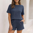 Navy blue ribbed knit relaxed two-piece set from FJØRNA featuring a drop shoulder top and matching mini shorts.