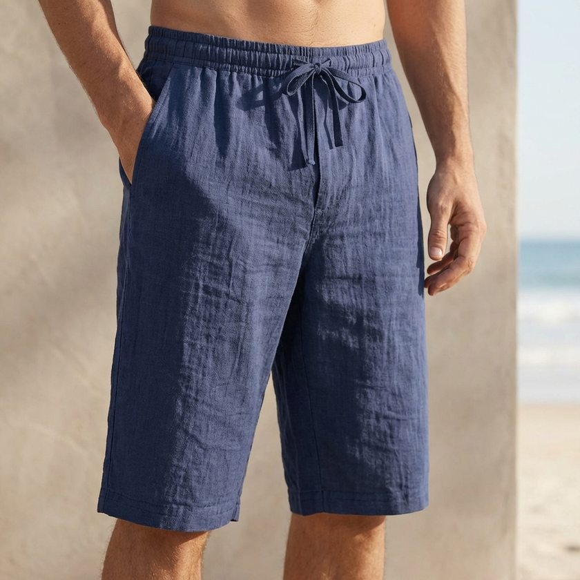 Navy blue men's casual knee-length chino shorts with adjustable drawstring waist, ideal for vacation wear by FJØRNA.