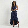 Navy blue satin halter neck wrap maxi dress with bow tie waist and ruffled hem, by FJØRNA, displayed on a mannequin.