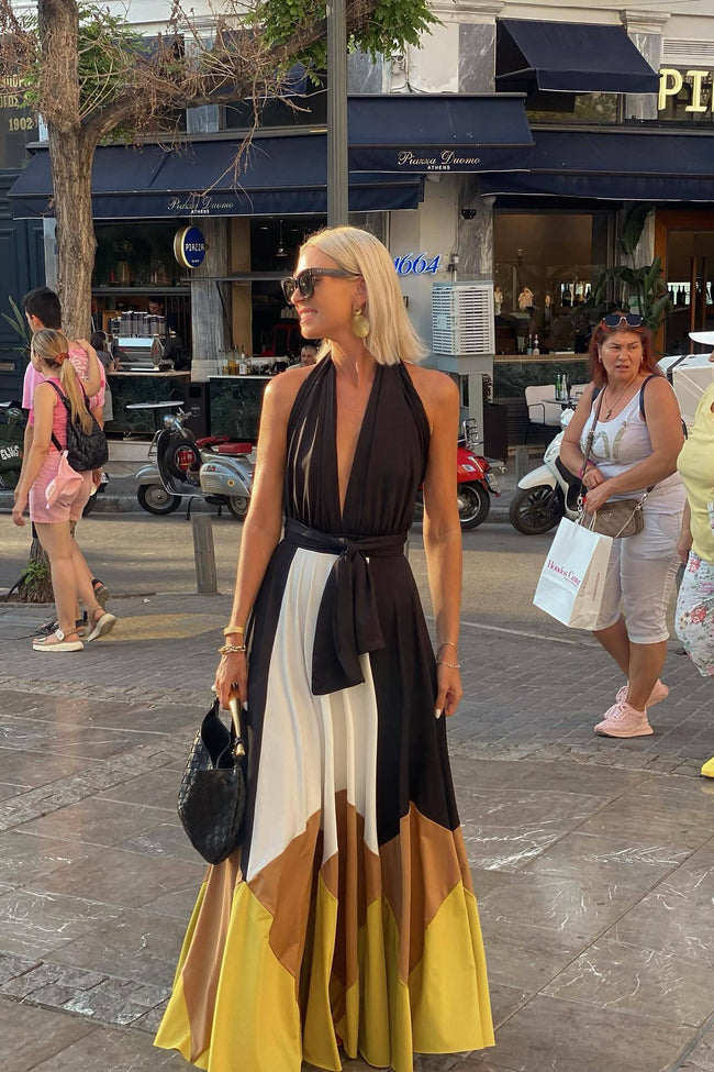 White Polymorphic Maxi Dress by FJØRNA, flowing fabric with elegant design, showcased on a model.
