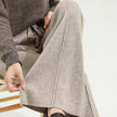 Women’s wide-leg merino wool trousers by FJØRNA, high-waist pants with a cozy, elegant fit and natural wool texture.
