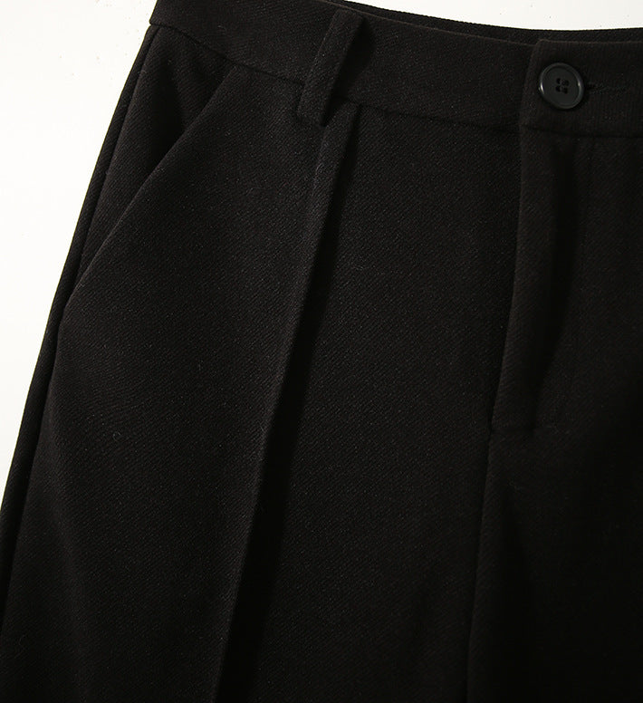 Women’s wool tapered trousers by FJØRNA, featuring a tailored fit, soft fabric, and classic design for versatile style.