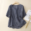 FJØRNA women's summer blouse with V-neck, short sleeves, made of light linen fabric, stylish and breathable for warm weather.