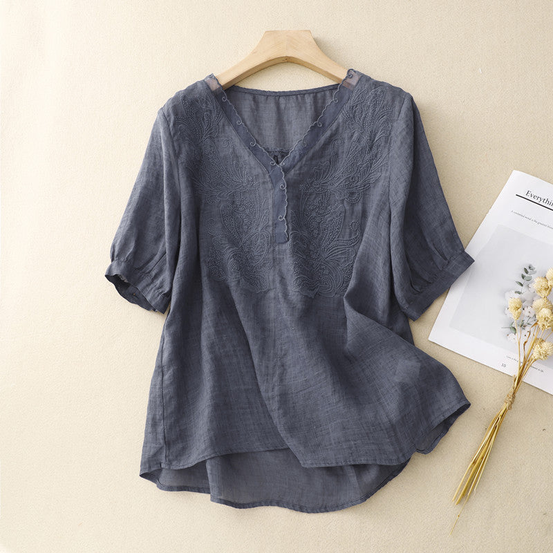 FJØRNA women's summer blouse with V-neck, short sleeves, made of light linen fabric, stylish and breathable for warm weather.
