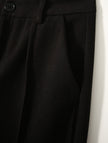 FJØRNA women's wool tapered trousers, stylish slim-fit pants with a smooth fabric finish, perfect for professional or casual wear.