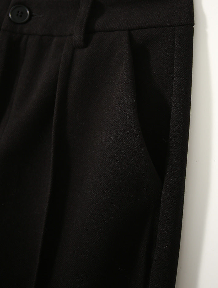 FJØRNA women's wool tapered trousers, stylish slim-fit pants with a smooth fabric finish, perfect for professional or casual wear.