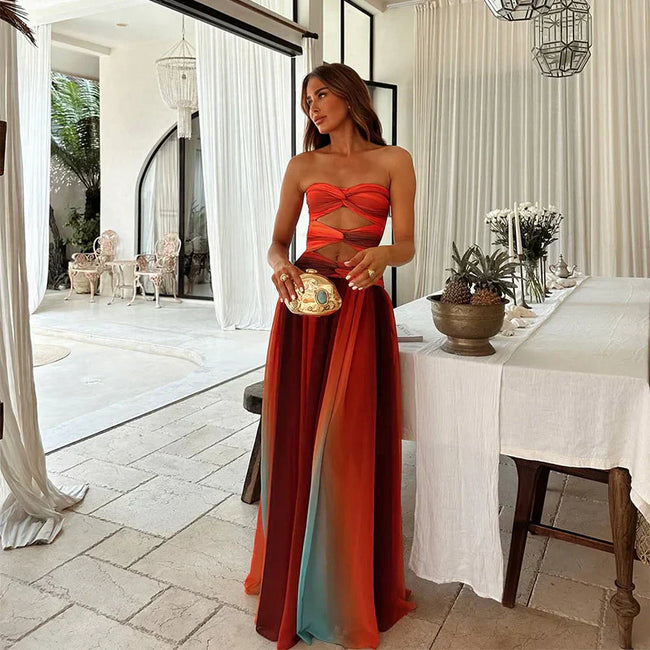 FJØRNA women's elegant maxi dress with geometric strapless design, flowing fabric and stylish silhouette for formal occasions.