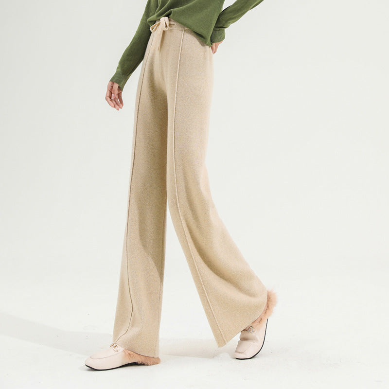 FJØRNA women's wide-leg merino wool trousers with high waist, showcasing a soft, stylish fit and tailored design.