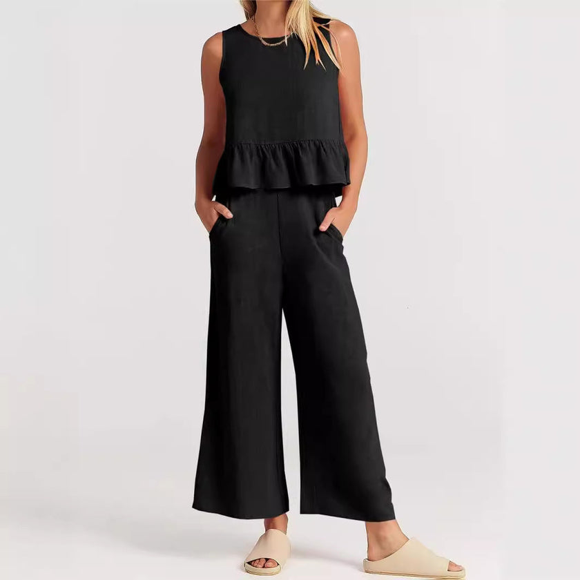 FJØRNA elegant two-piece linen ruffle co-ord set for women, featuring a stylish top and matching skirt in natural linen fabric.