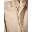 FJØRNA women's tapered wool trousers, stylish and comfortable pants with a tailored fit, shown in a natural pose.