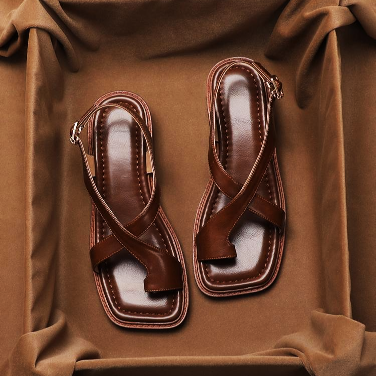 FJØRNA women's Italian leather sandals with adjustable straps, open-toe design, and cross strap detail.
