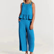 Elegant two-piece women's linen ruffle co-ord set by FJØRNA, featuring a stylish top and matching skirt in natural linen fabric.