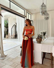 FJØRNA elegant maxi dress for women with geometric strapless design, flowing fabric, and stylish silhouette.