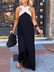 White FJØRNA dress, elegant sleeveless design with a flowing skirt, perfect for casual or formal occasions.
