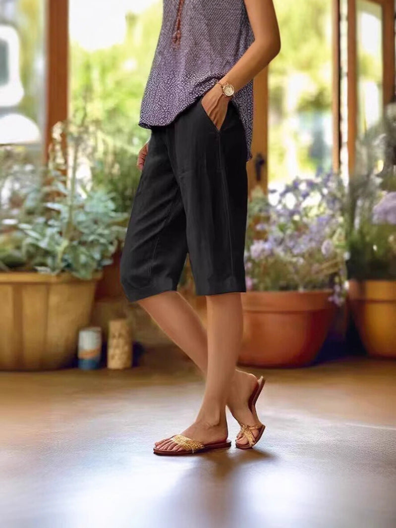 FJØRNA lightweight summer shorts for women with relaxed fit, elastic waistband, and side pockets, perfect for warm weather.