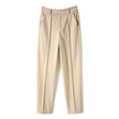 FJØRNA women's wool tapered trousers, stylish and comfortable pants for women, shown in a neutral color on a model.
