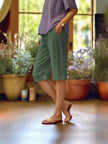 FJØRNA lightweight women's summer shorts with relaxed fit, elastic waist, and side pockets, perfect for casual warm weather wear.