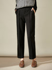 FJØRNA women's wool tapered trousers, stylish and comfortable pants with a tailored fit, showcased in a natural pose.