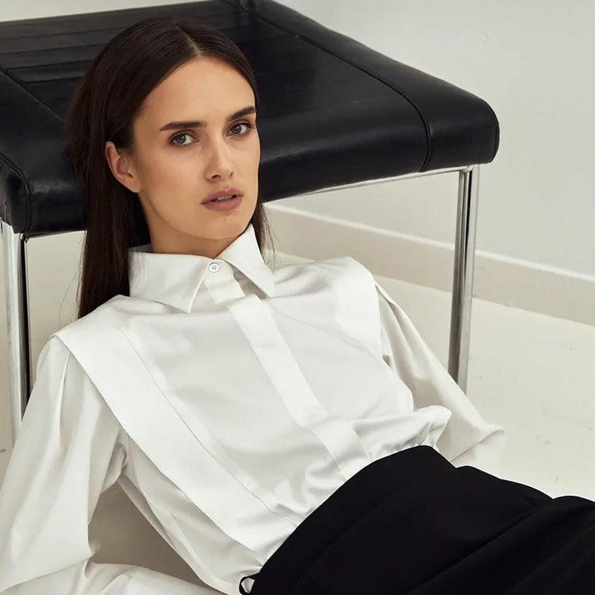 FJØRNA women's cotton blouse, long-sleeve top with lightweight fabric and classic design, shown on a model.
