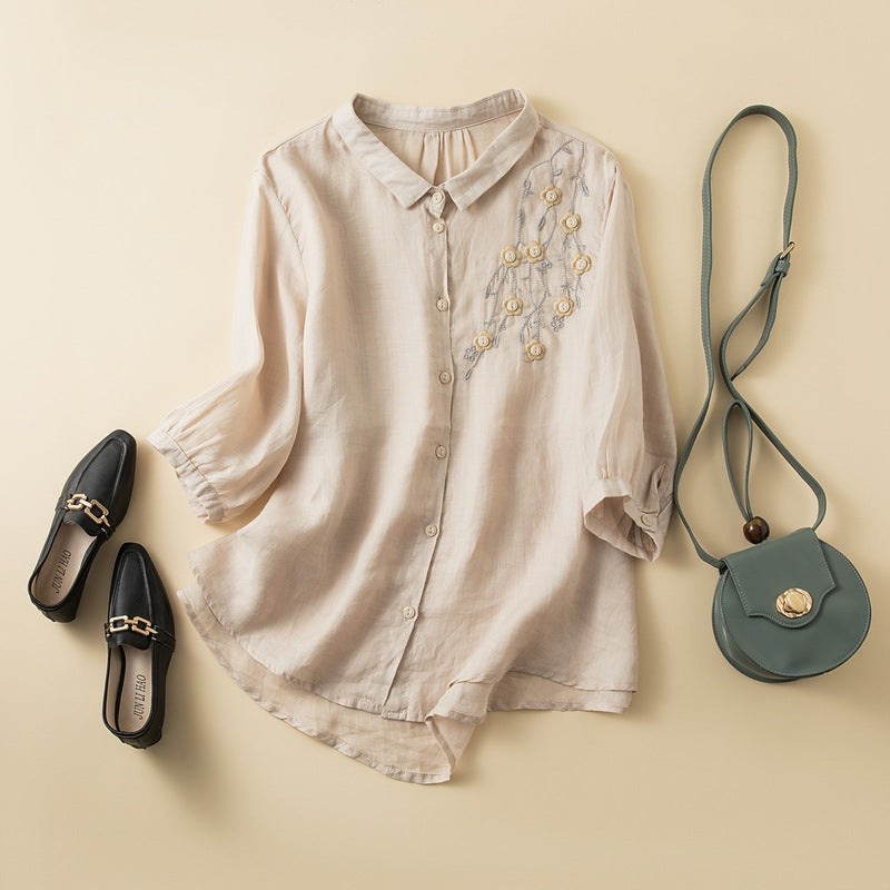 FJØRNA women's floral linen summer blouse with a relaxed fit, showcasing a vibrant floral print and lightweight fabric.