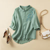 FJØRNA women's floral linen summer blouse with short sleeves and lightweight fabric, perfect for warm weather.